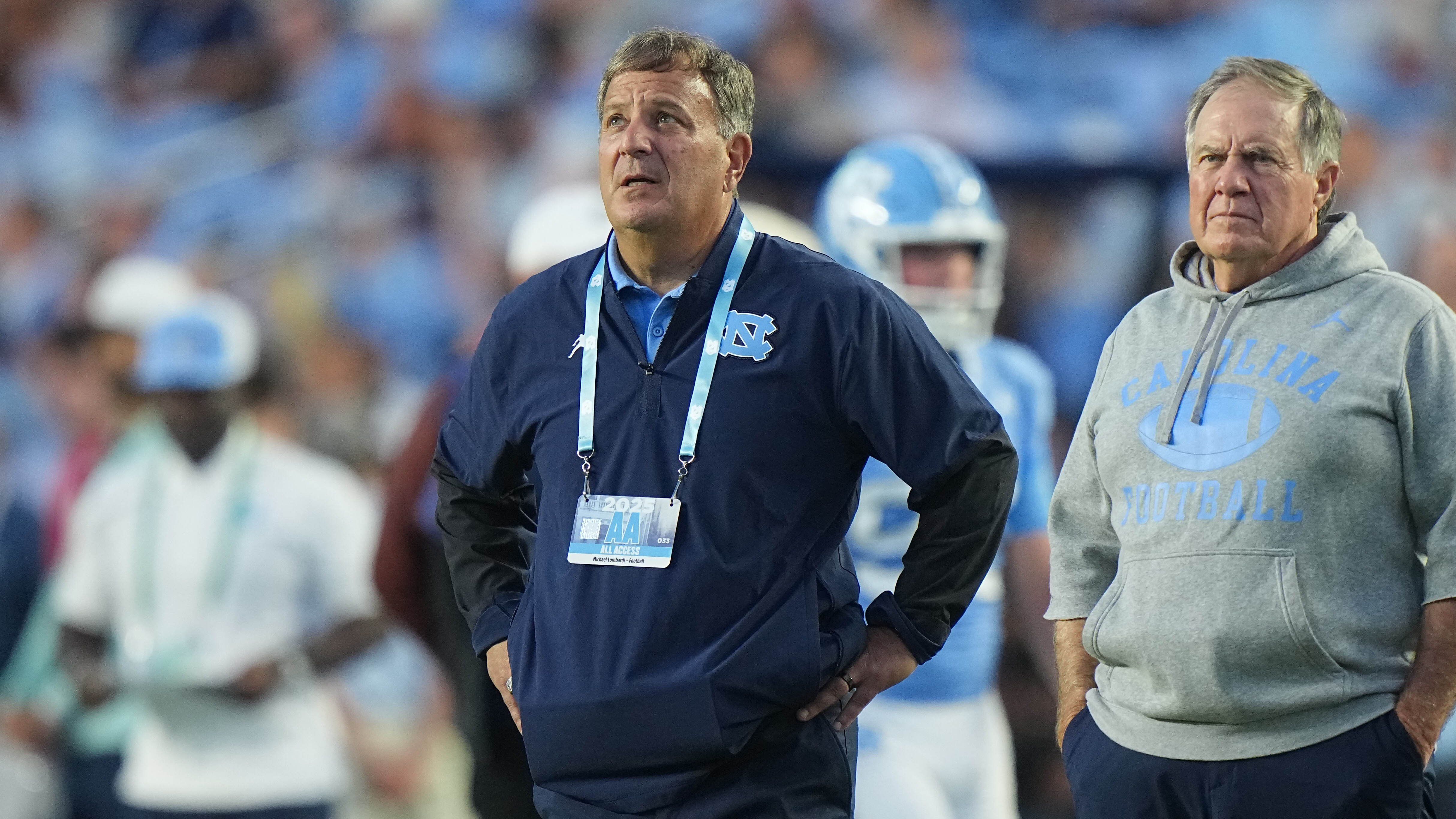North Carolina head coach Bill Belichick and general manager Michael Lombardi on the sideline against TCU at Kenan Memorial Stadium in Chapel Hill, N.C., on Sept. 1, 2025. - nbcboston.com