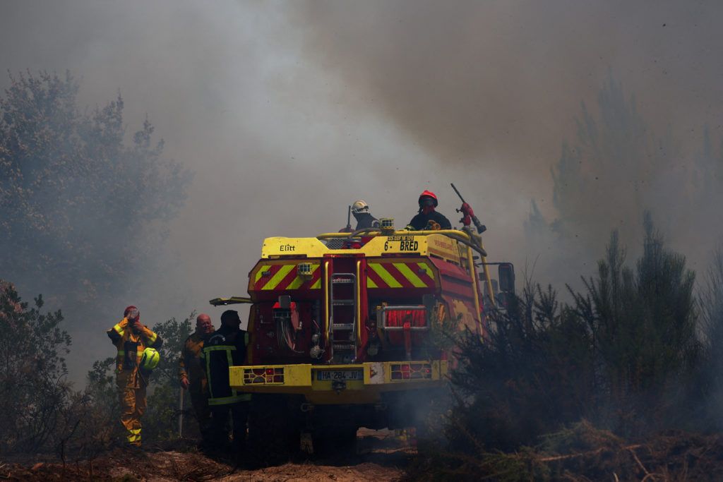 Wildfire smoke and flames in France during the July 2026 fire season. - Reuters