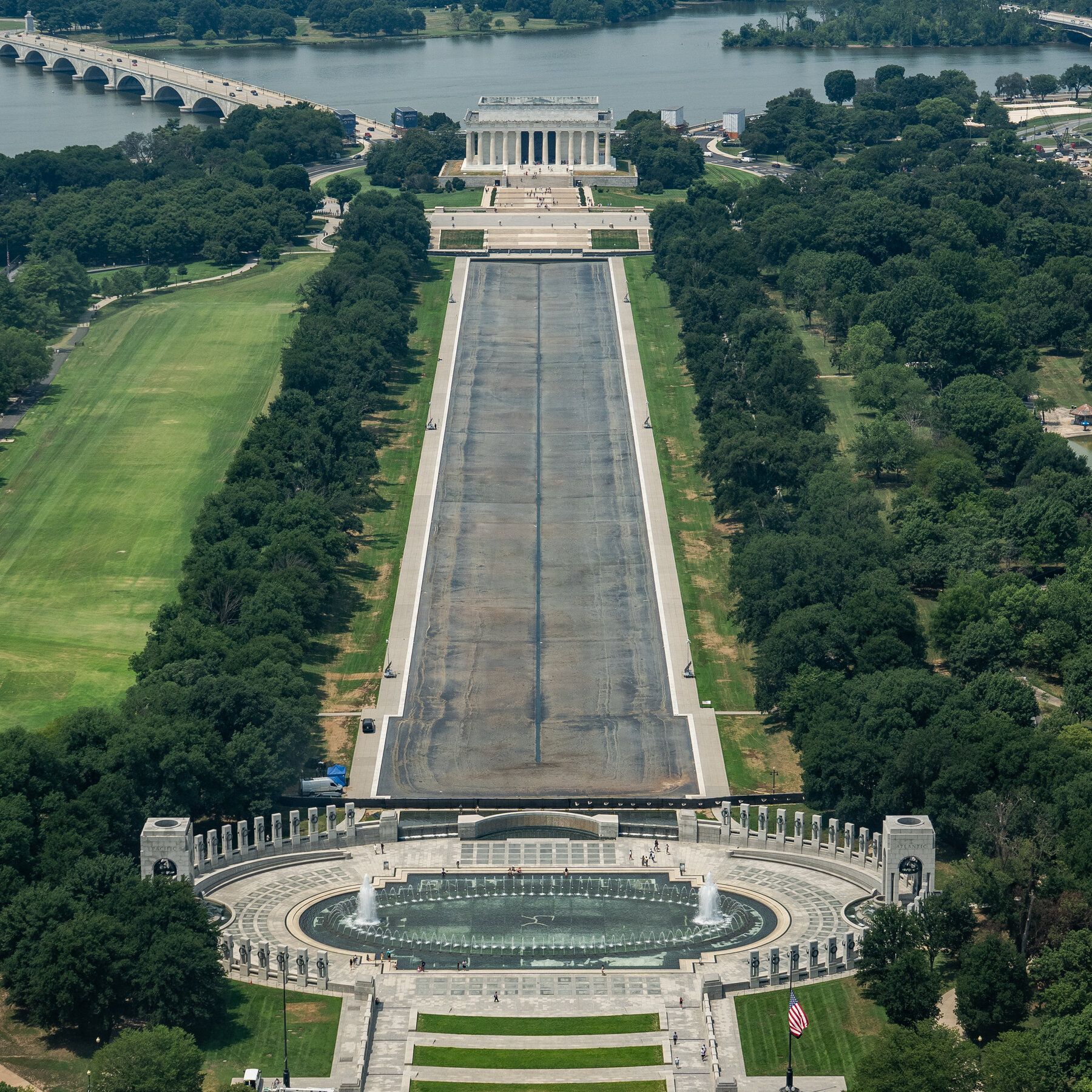 The Lincoln Memorial Reflecting Pool sat empty and fenced in last month, after what prosecutors said was a “botched” renovation. - The New York Times