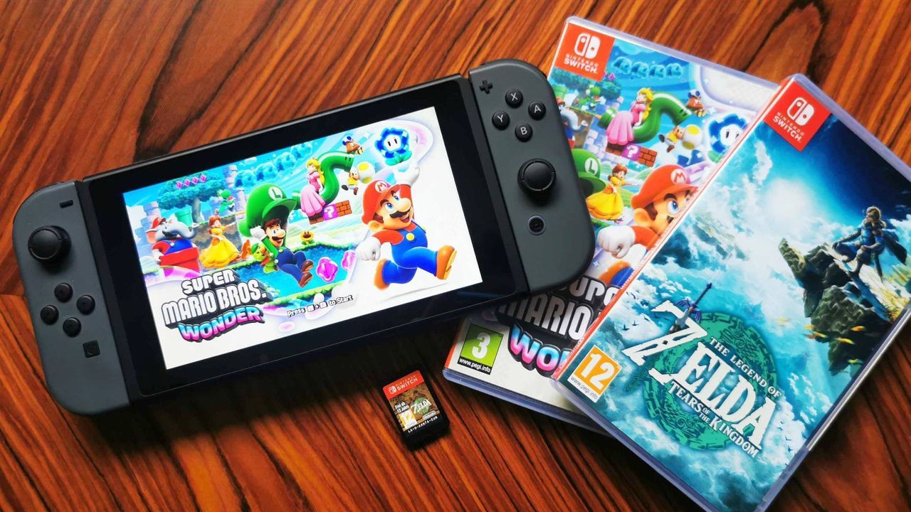 Nintendo Switch with Super Mario Wonder on screen next to Zelda: Tears of the Kingdom box - gamesradar.com