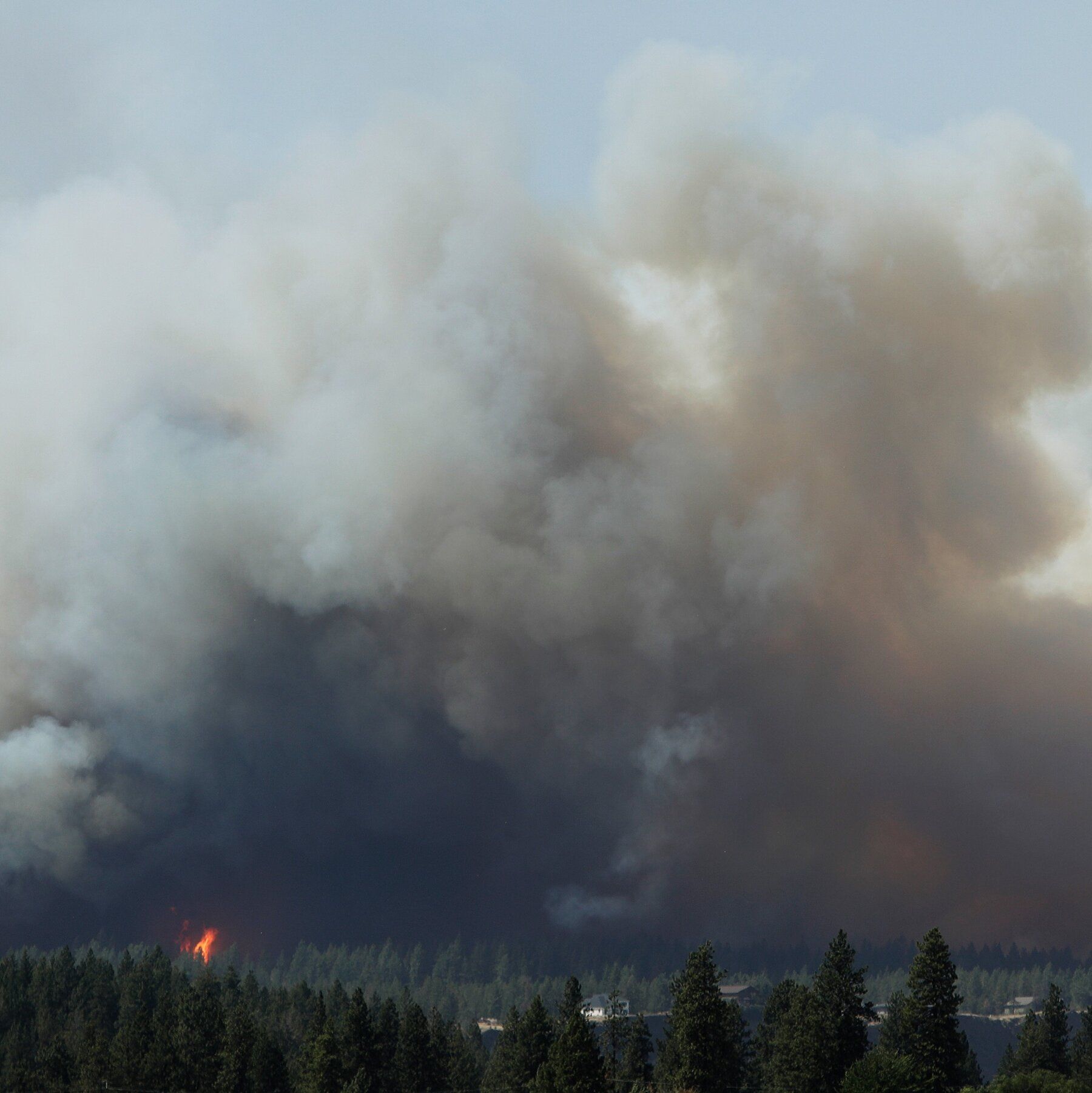 The Old Trails fire is seen from the Centennial Trail near West College Ave. in Spokane, Wash., on Saturday. - nytimes.com