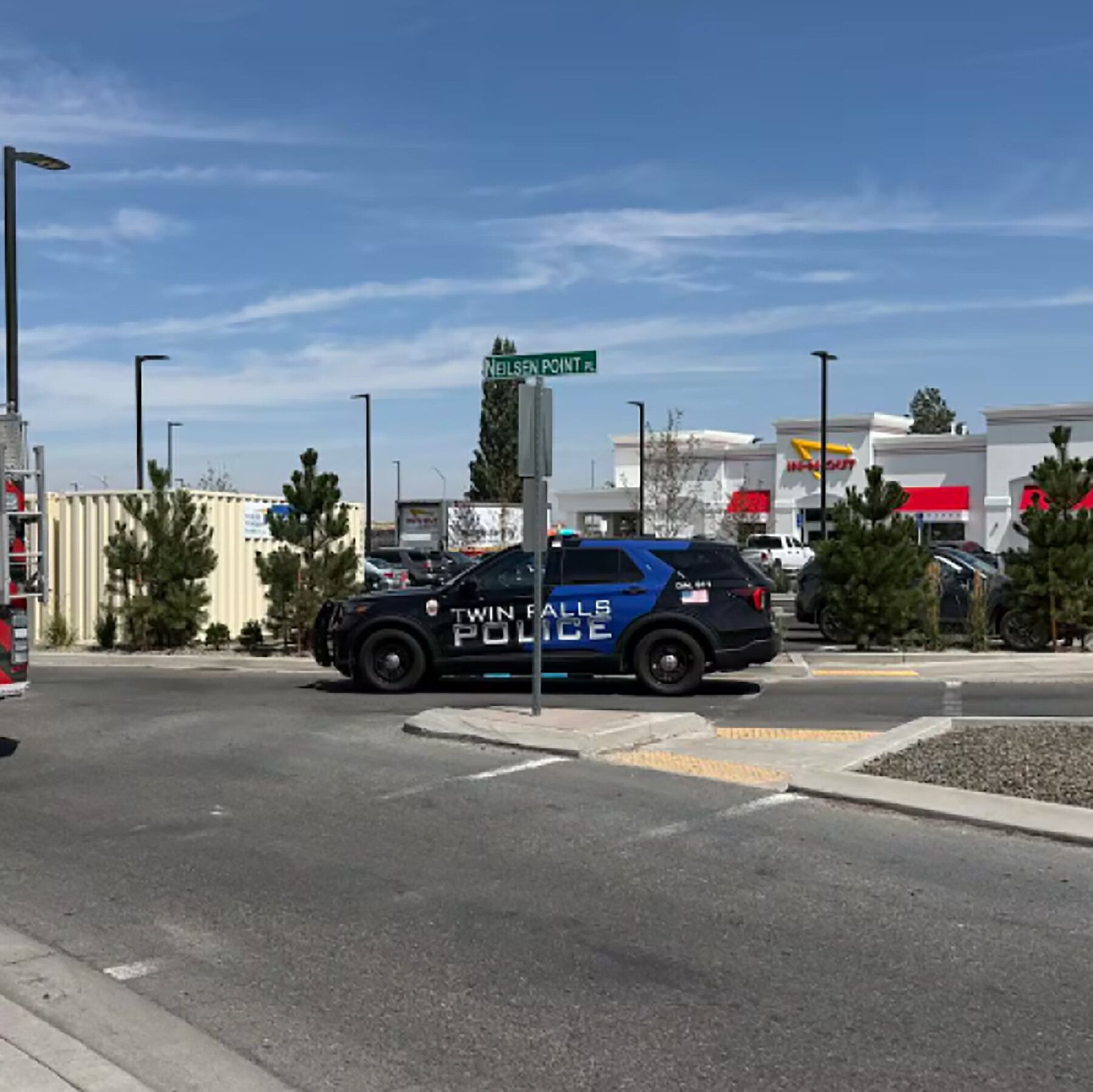 Police and fire crews respond at an In-N-Out Burger restaurant in Twin Falls, Idaho, on Saturday after a shooting that left at least three people dead. - nytimes.com
