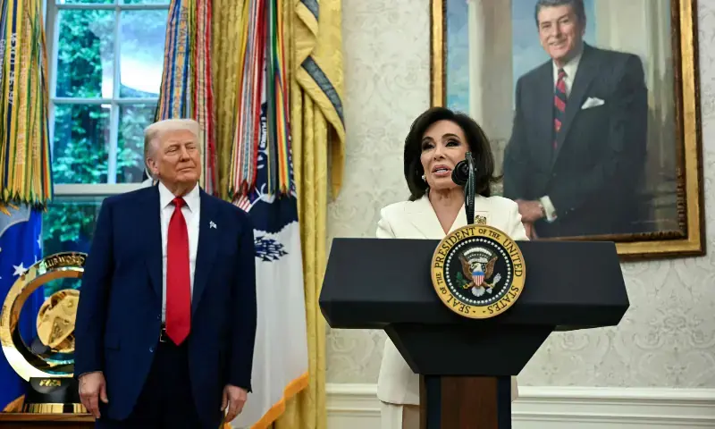 President Donald Trump looks on as interim U.S. Attorney Jeanine Pirro speaks during her swearing-in ceremony in the Oval Office on May 28, 2025. - AFP/File