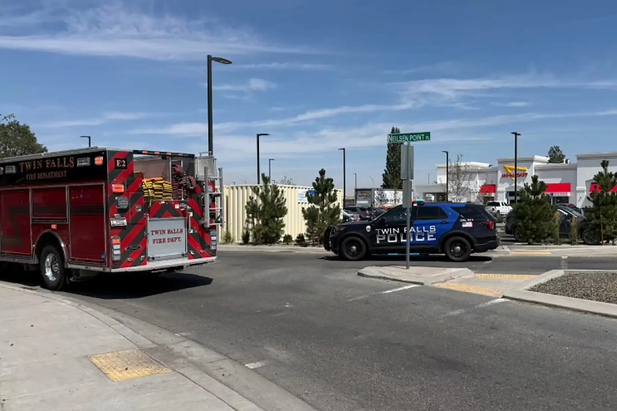 Police and fire crews respond at an In-N-Out Burger restaurant in Twin Falls, Idaho, after the shooting. - KMVT via Associated Press
