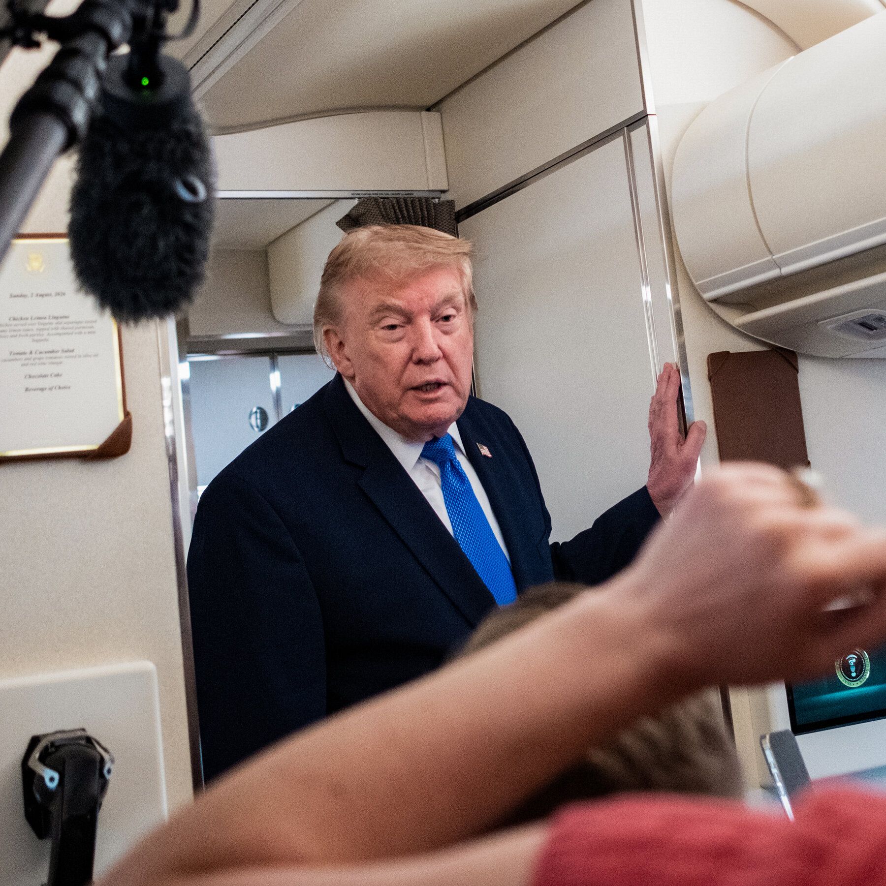 President Donald Trump aboard Air Force One on Sunday. He said that talks with Iran would begin on Monday and that there could be a deal to reopen the Strait of Hormuz. - nytimes.com