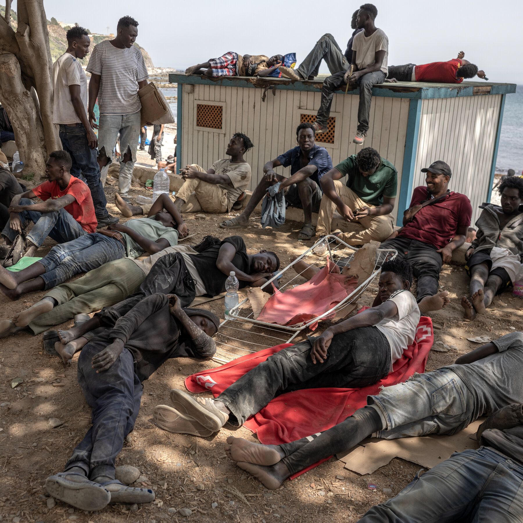 Some migrants were waiting it out on a beach in Ceuta after crossing from Morocco days earlier. - The New York Times