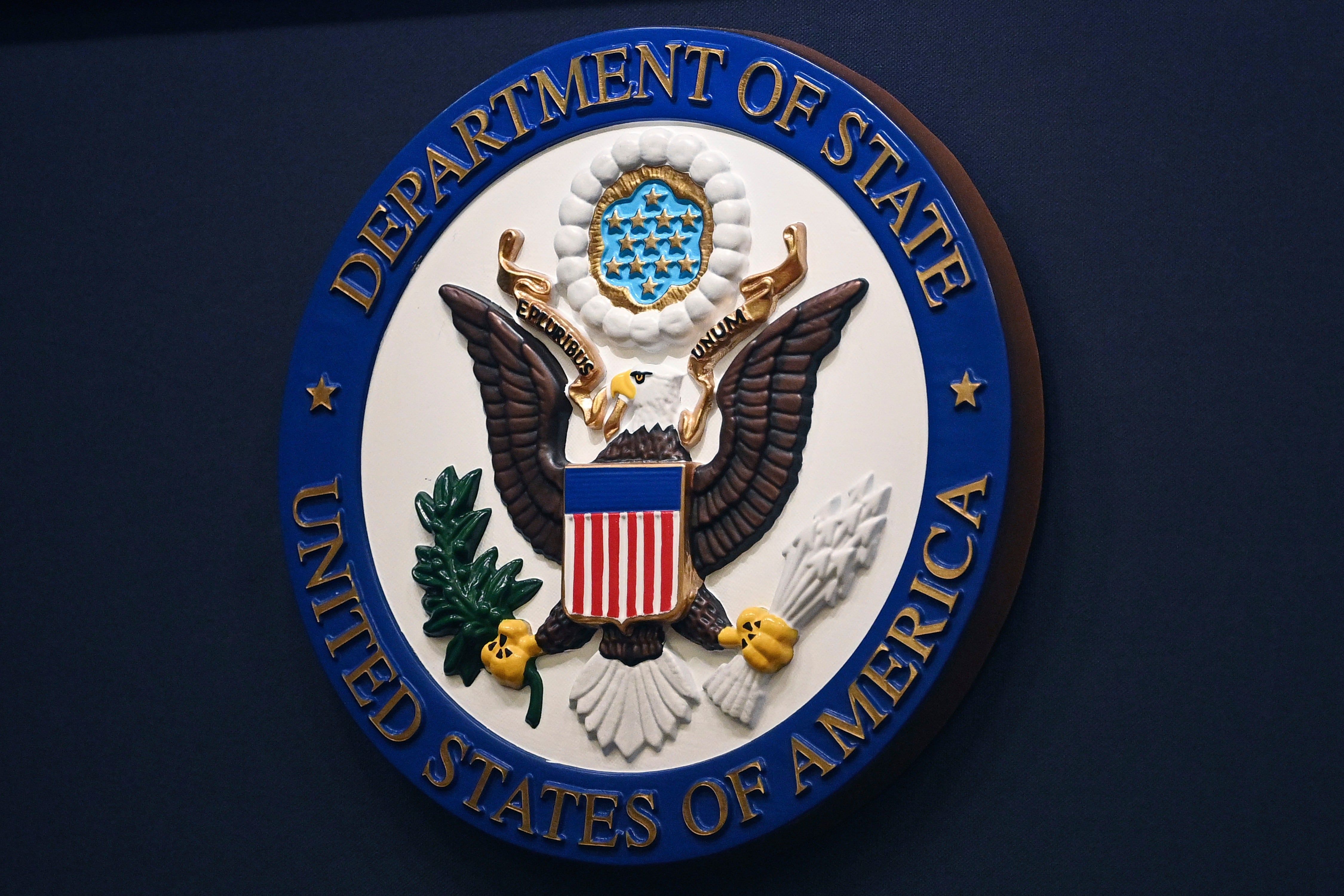 The State Department seal is seen on the briefing room lectern at the State Department in Washington, Jan. 31, 2022. - Mandel Ngan, Pool via AP, File