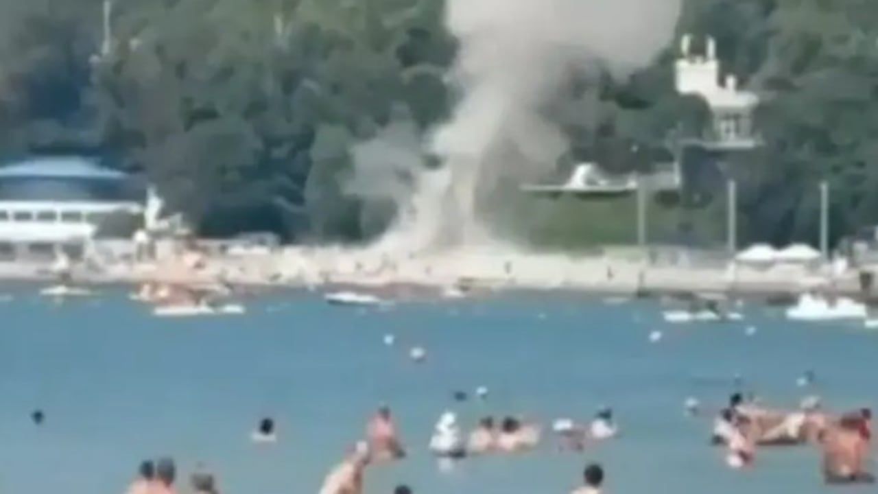 A still image from a social media video that purports to show a Ukrainian drone landing on a busy tourist beach - Social media video