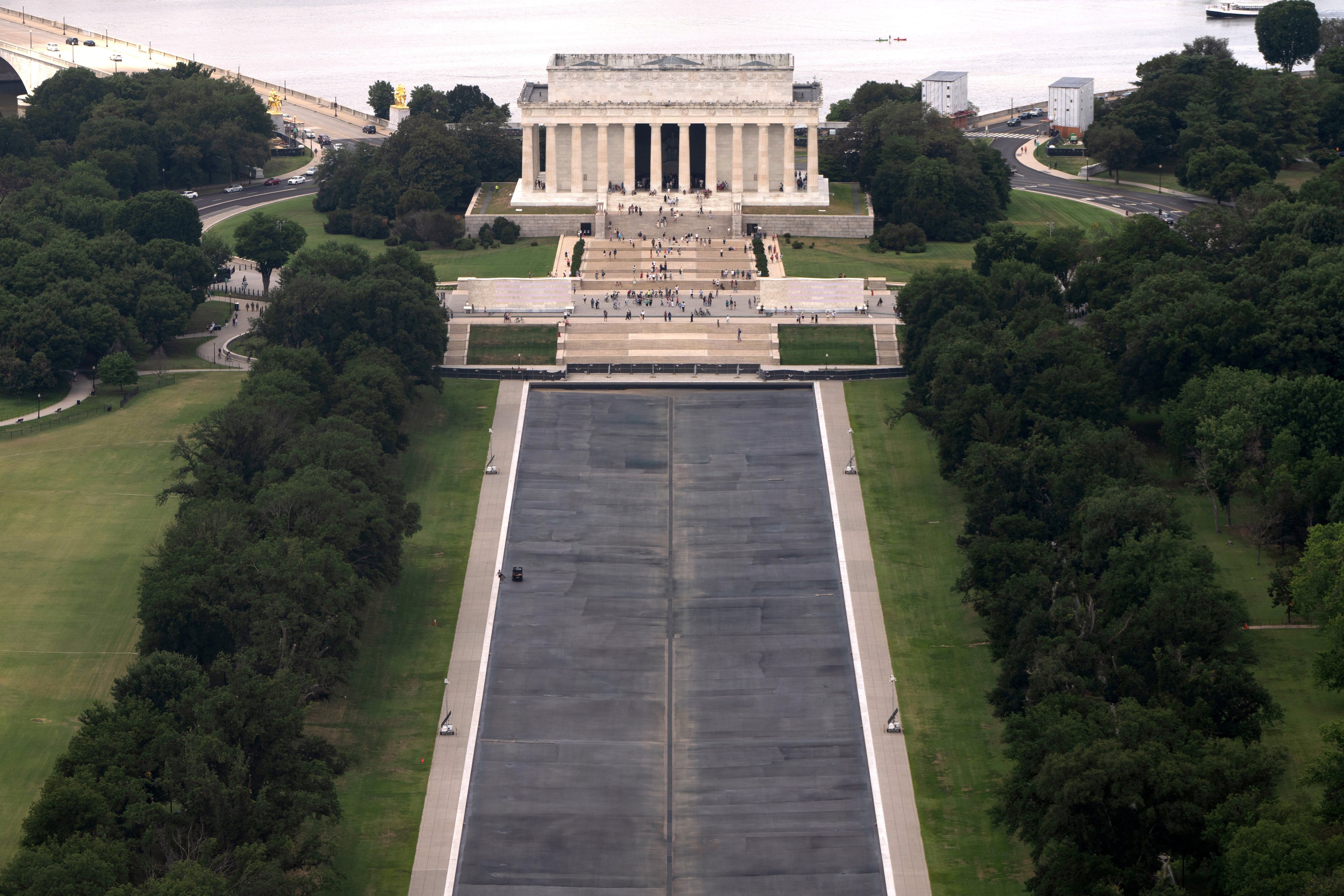 The Lincoln Memorial Reflecting Pool is seen from the Washington Monument, Friday, July 31, 2026, in Washington. - AP Photo/Mark Schiefelbein