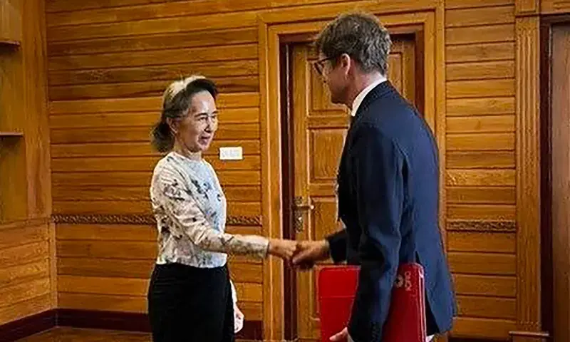 Detained former civilian leader Aung San Suu Kyi meets Arnaud de Baecque, resident representative of the International Committee of the Red Cross to Myanmar, in Naypyidaw. - Myanmar Presidential Press and Information Bureau via AFP