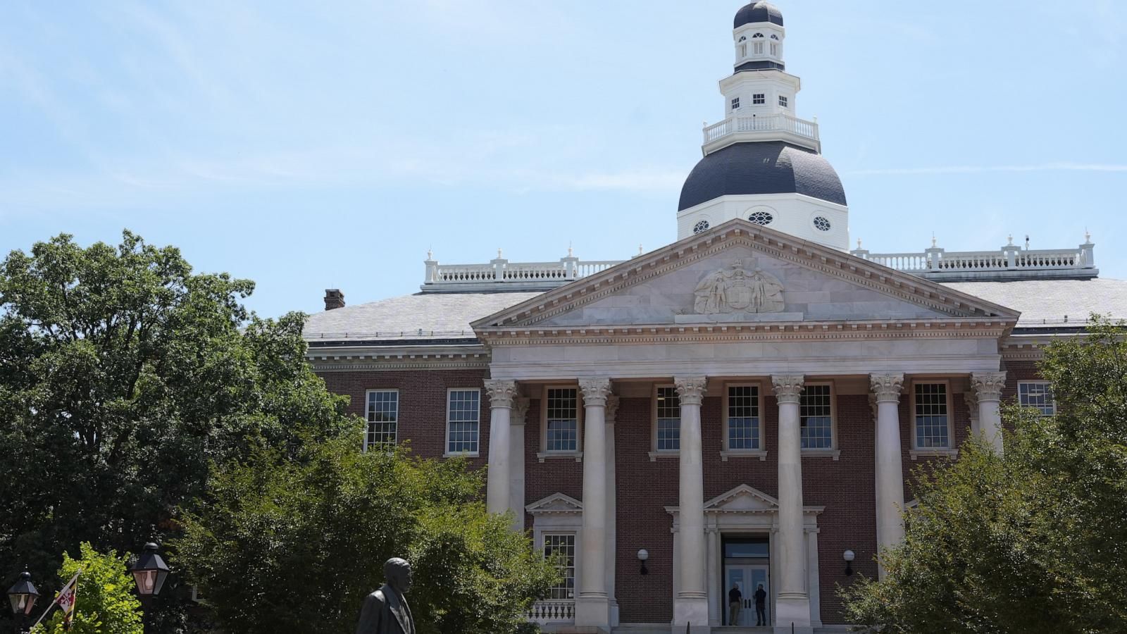 People stand at the doors of the Maryland State House on Tuesday, Aug. 4, 2026, in Annapolis, Md. - AP Photo/Mingson Lau