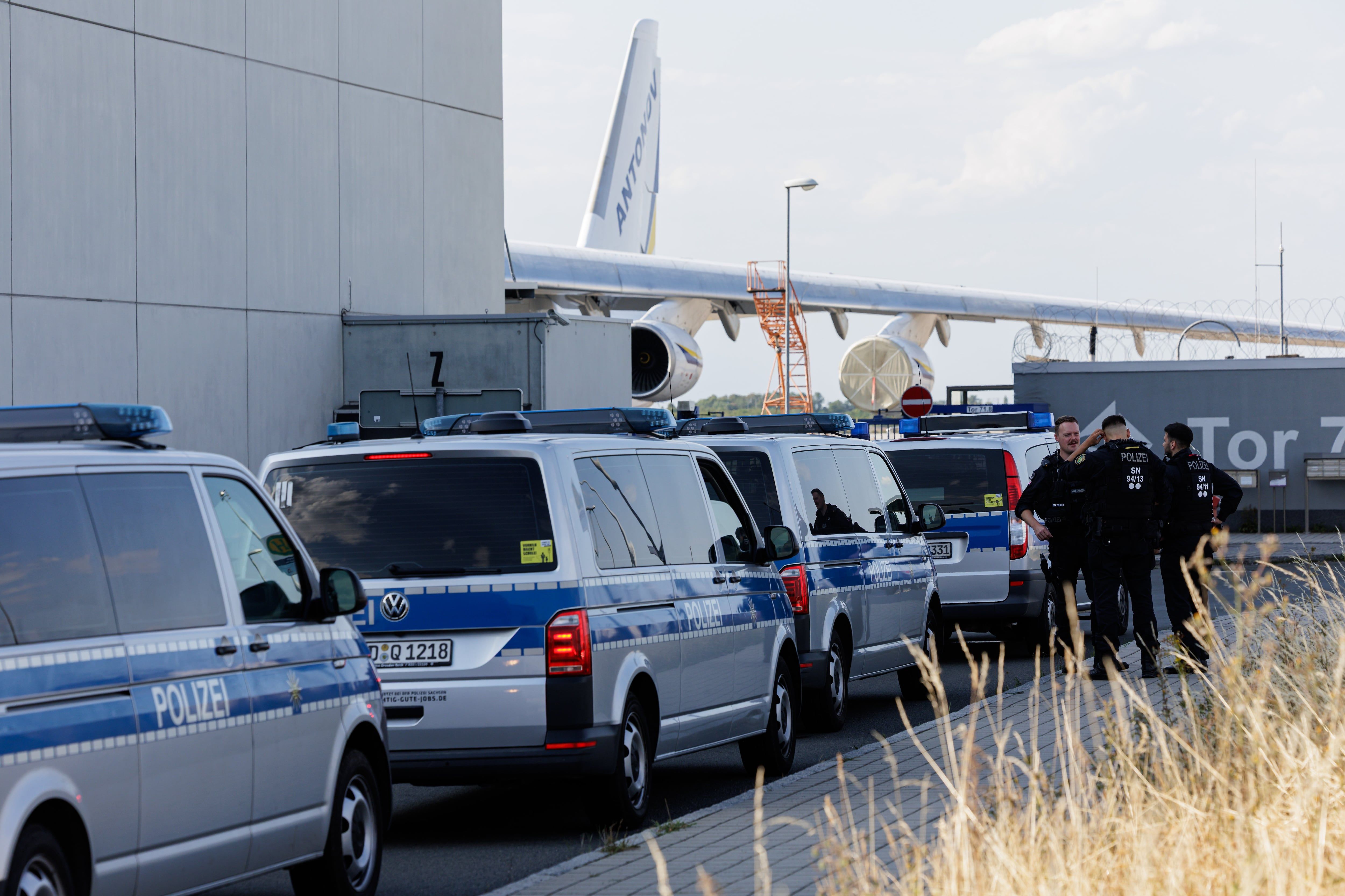 Riot police near a Ukrainian Antonov cargo plane at Leipzig/Halle Airport on August 5, 2026. - Jens Schlueter/Getty Images