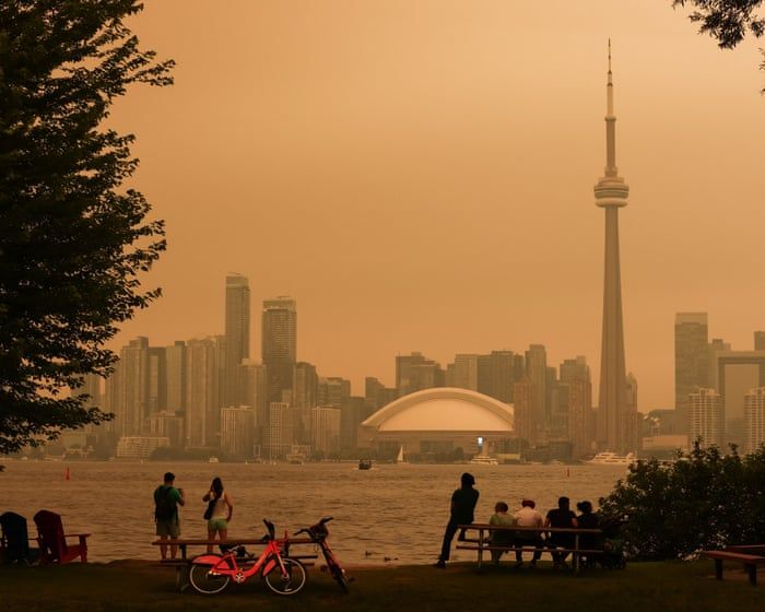People look toward the downtown skyline from the Toronto Islands as forest fires cause poor air quality over the city. - Cole Burston/AFP/Getty Images