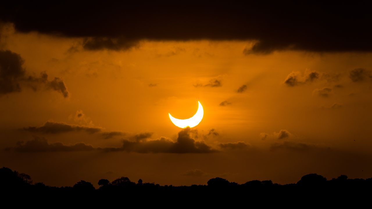 Partial solar eclipse of Oct. 14, 2023, during sunset as seen from Natal, Brazil. - space.com