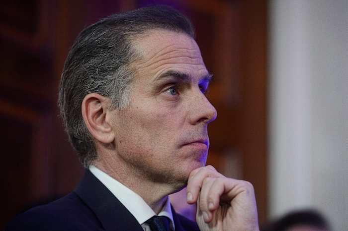 FILE - Hunter Biden listens while his father, President Joe Biden, speaks during a Hanukkah reception in the East Room of the White House in Washington, Dec. 16, 2024. - AP Photo/Rod Lamkey, Jr.