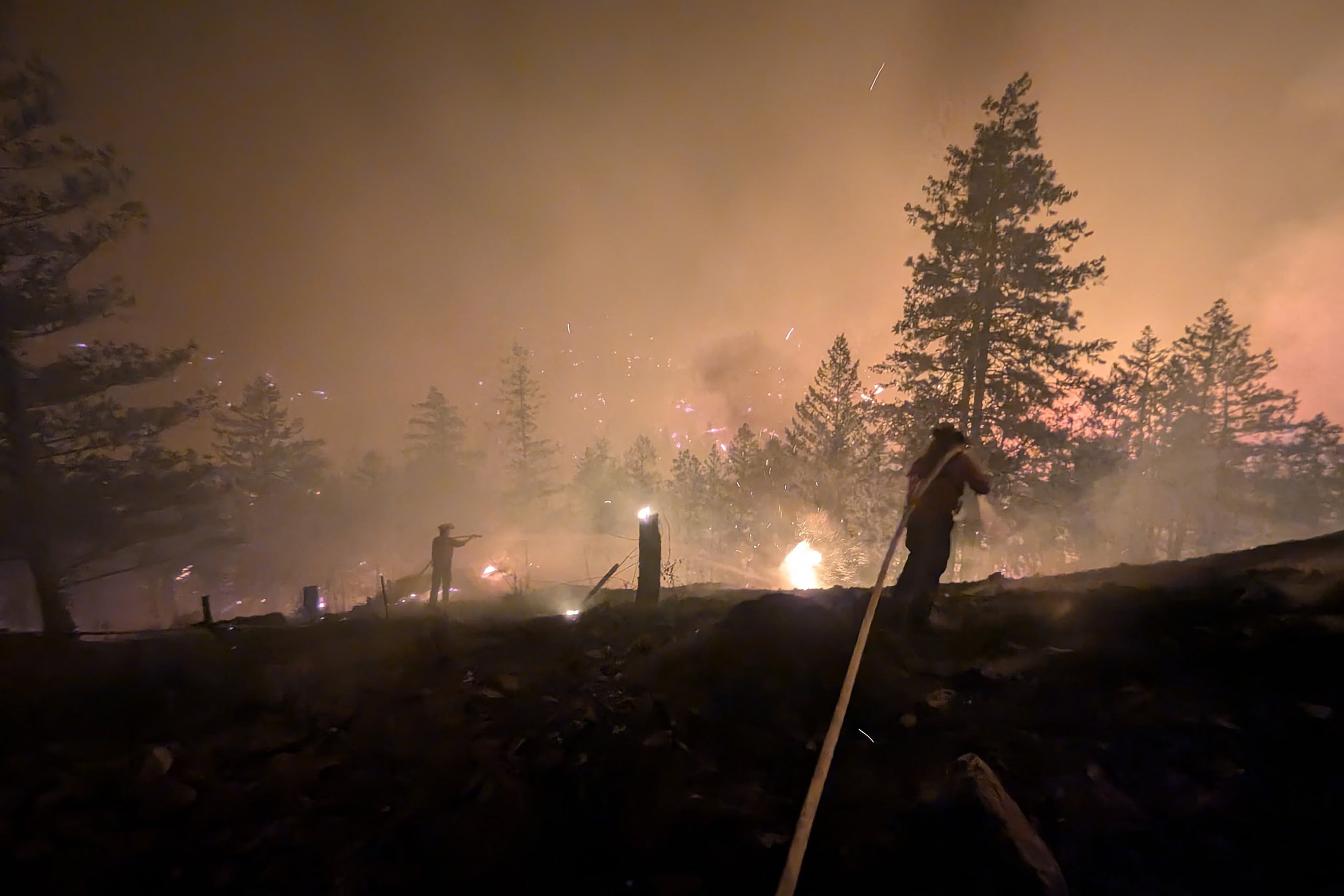 Firefighters battle the Bald Range wildfire near Summerland in British Columbia on Aug. 7, 2026. - BC Wildfire Service/AFP via Getty Images
