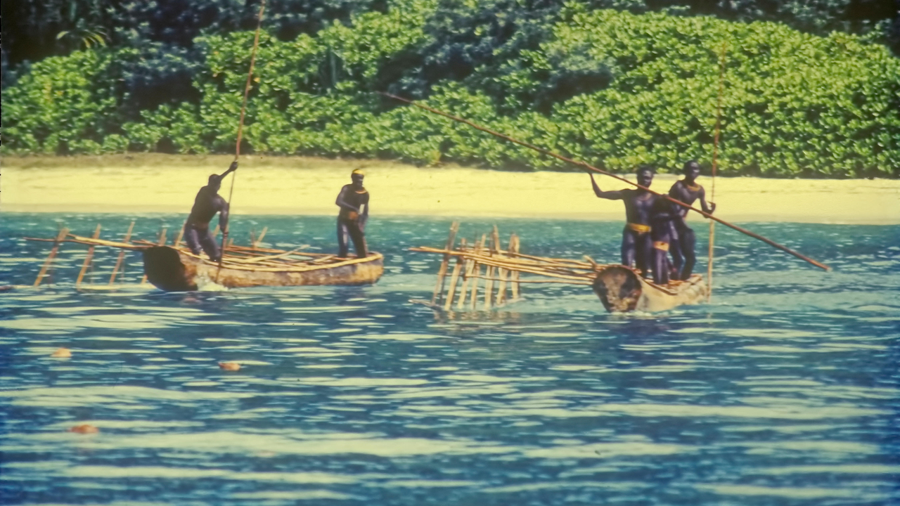 In this undated photo, an uncontacted people known as the Sentinelese confront an administration contact party approaching North Sentinel Island. - Nutu via Alamy