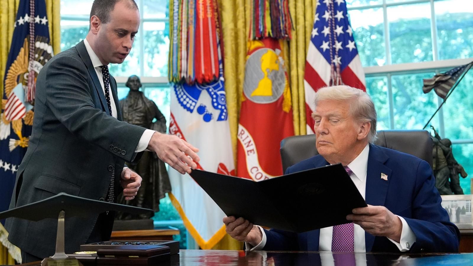 White House staff secretary Will Scharf hands President Donald Trump an executive order to sign in the Oval Office on Sept. 5, 2025. - AP Photo/Alex Brandon