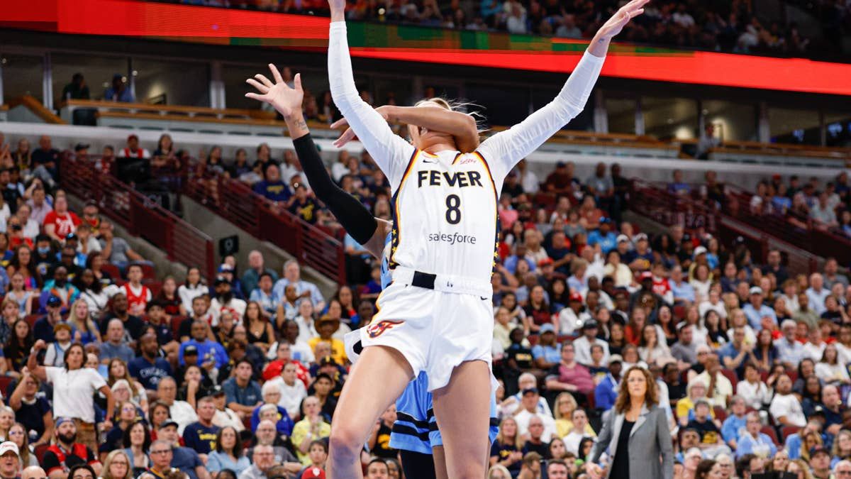 Indiana Fever guard Sophie Cunningham is fouled by Chicago Sky guard DiJonai Carrington as she drives to the basket. - athlonsports.com