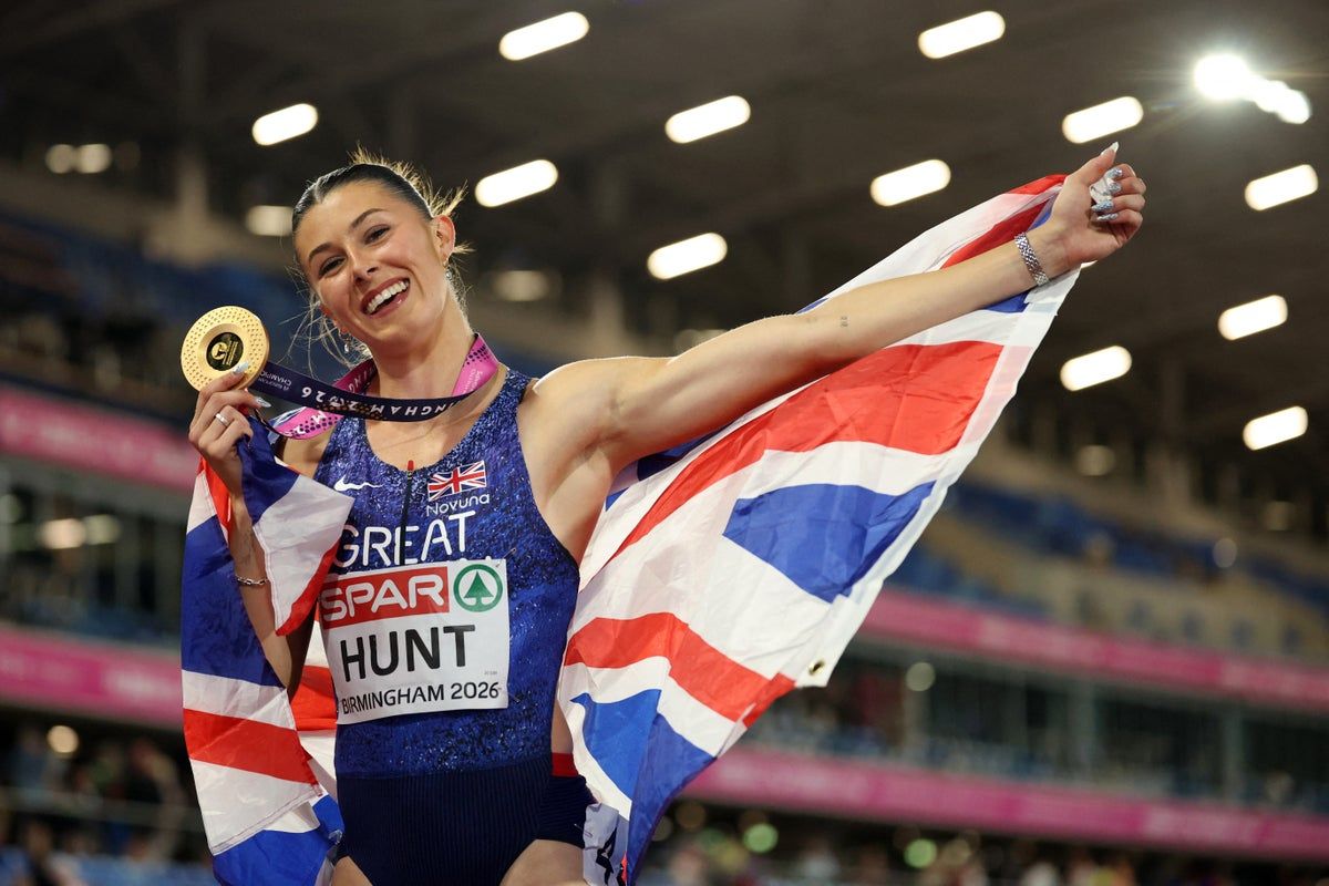 Amy Hunt celebrates with her gold medal after winning the European women’s 100m title. - Reuters