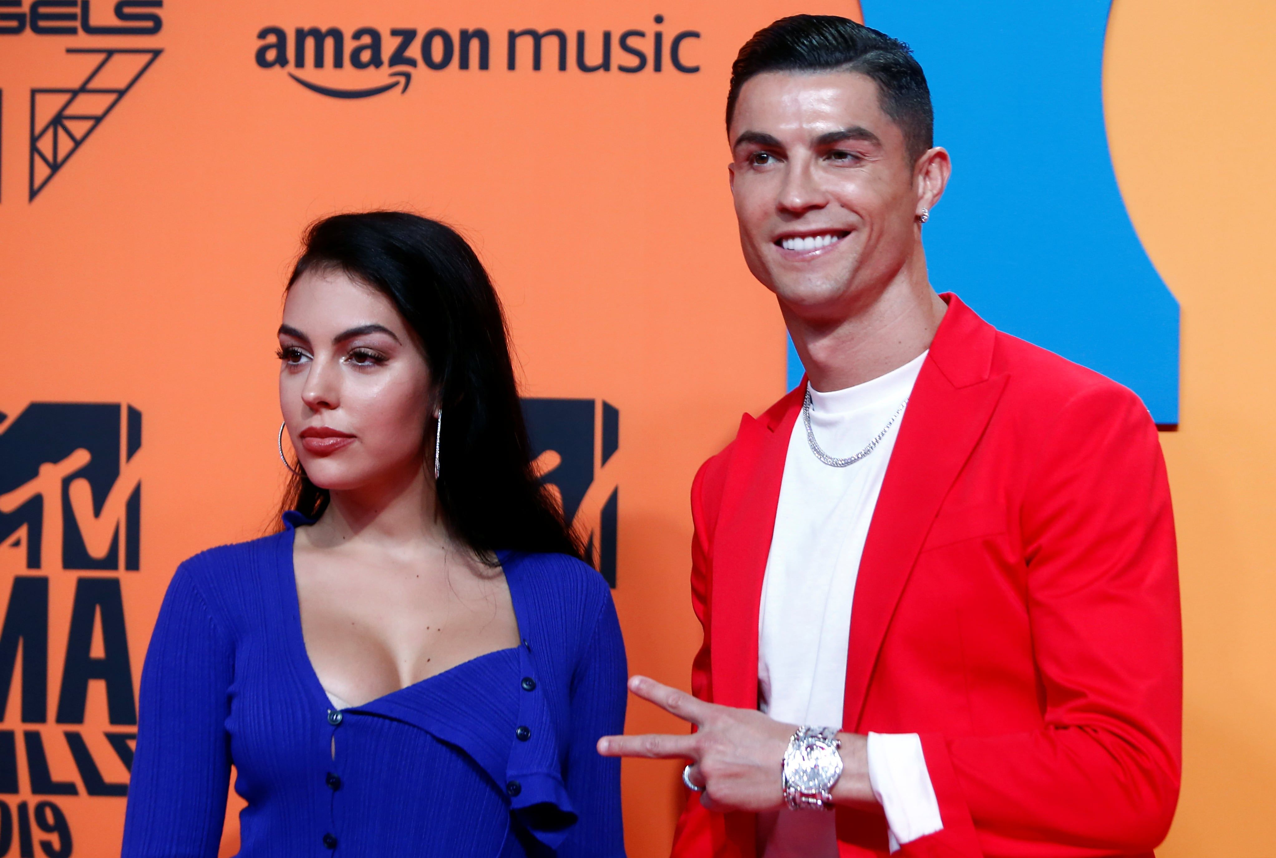 Cristiano Ronaldo and Georgina Rodriguez pose on the red carpet at the 2019 MTV Europe Music Awards. - Reuters