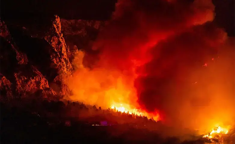 A wooded area is engulfed in flames during a wildfire near Omiš, Croatia. - AFP