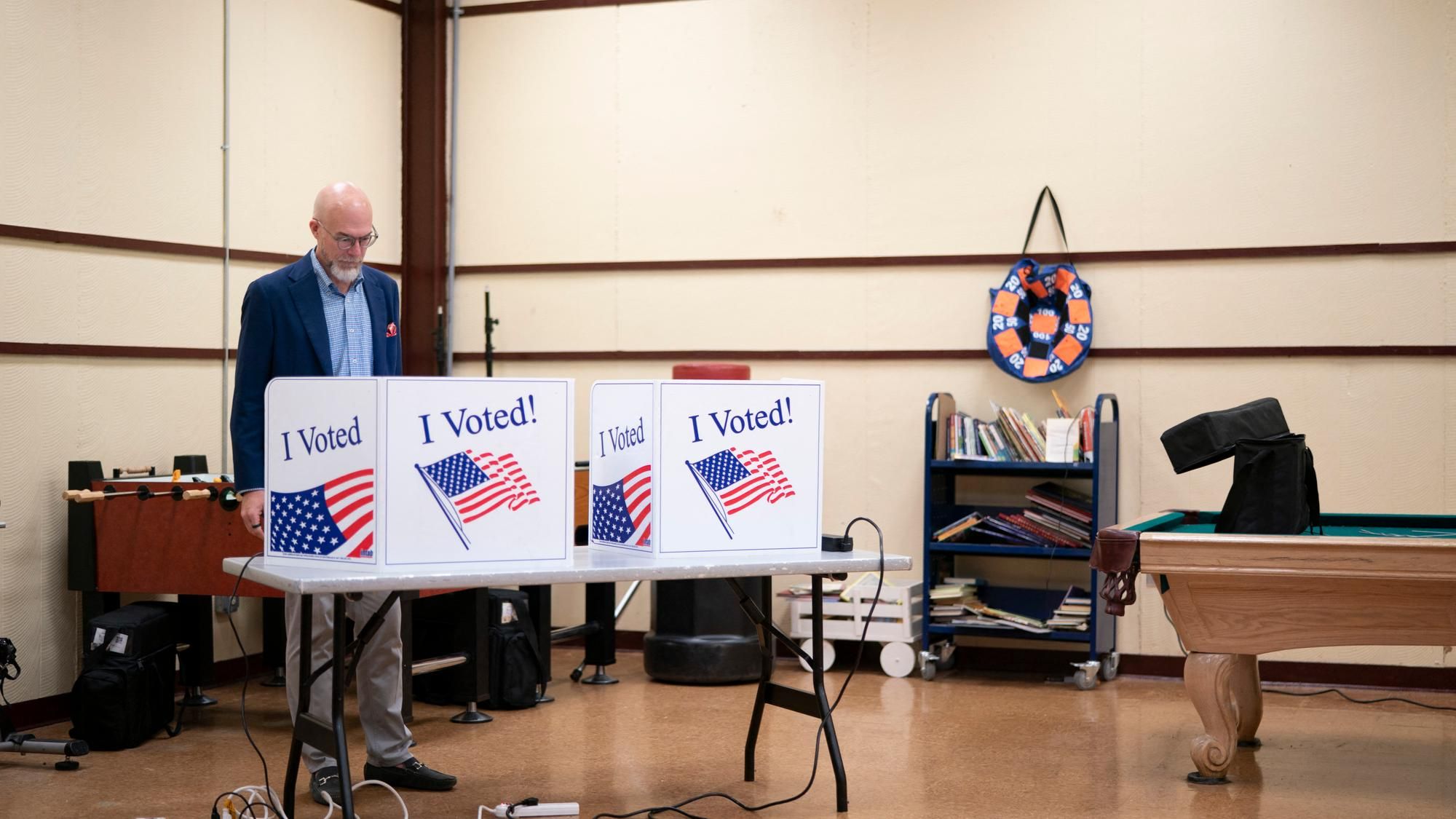 Wes Hickman fills out a ballot during a 2026 primary at Martin Luther King Jr. Park in Columbia, South Carolina. - Sean Rayford/Getty Images via AFP