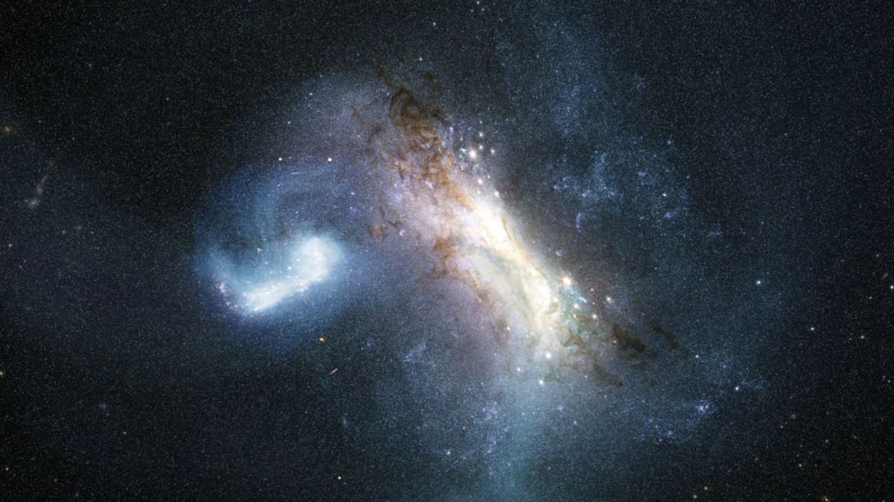 An artist's impression of the LKH dwarf galaxy merging with the young Milky Way 11.8 billion years ago. - NASA/ESA/Joseph Olmsted (STScI)