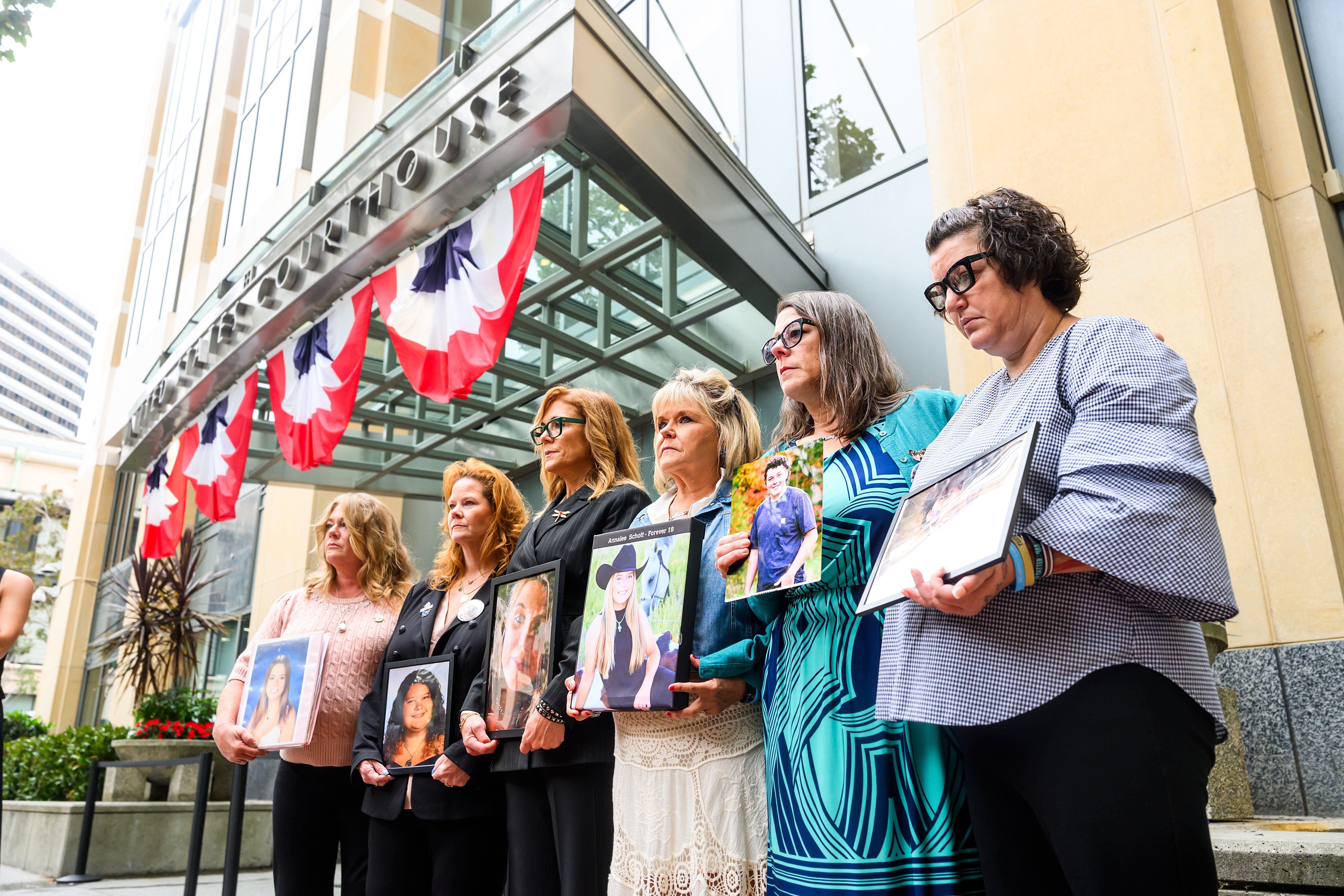 Parents hold pictures of their deceased children during a protest against social media platforms outside the Ronald V. Dellums Federal Building and U.S. Courthouse on Aug. 18, 2026, in Oakland, California. - AP