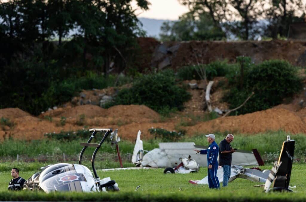 Authorities investigate a crash between a Pennsylvania State Police helicopter and a small plane at Carlisle Airport in Carlisle, Pennsylvania. - Sean Simmers/The Patriot-News via AP
