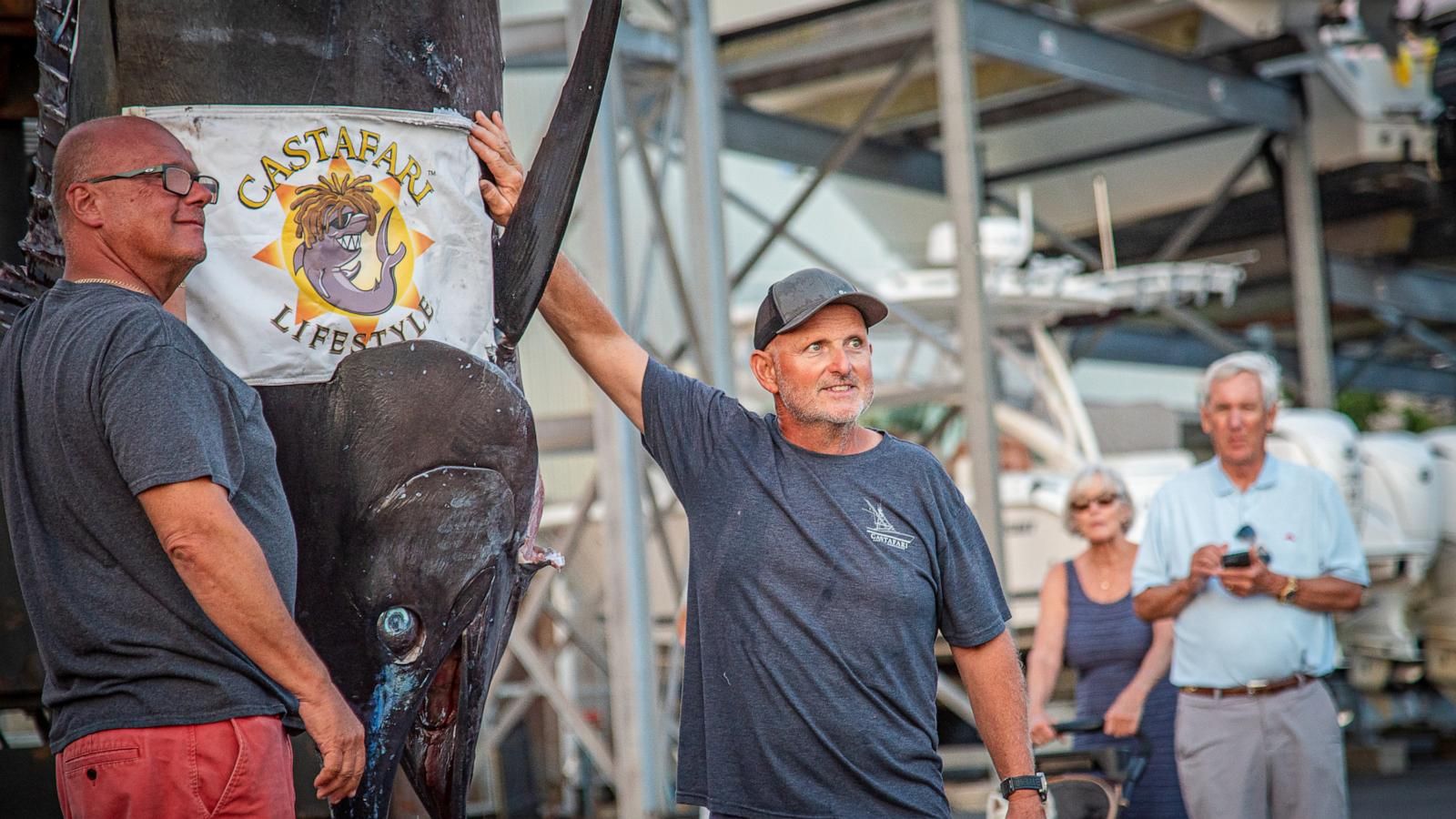 Walter Chapman and Damon Sacco pose with the Atlantic blue marlin caught off Massachusetts on Aug. 19, 2026. - Jimmy Fee via AP