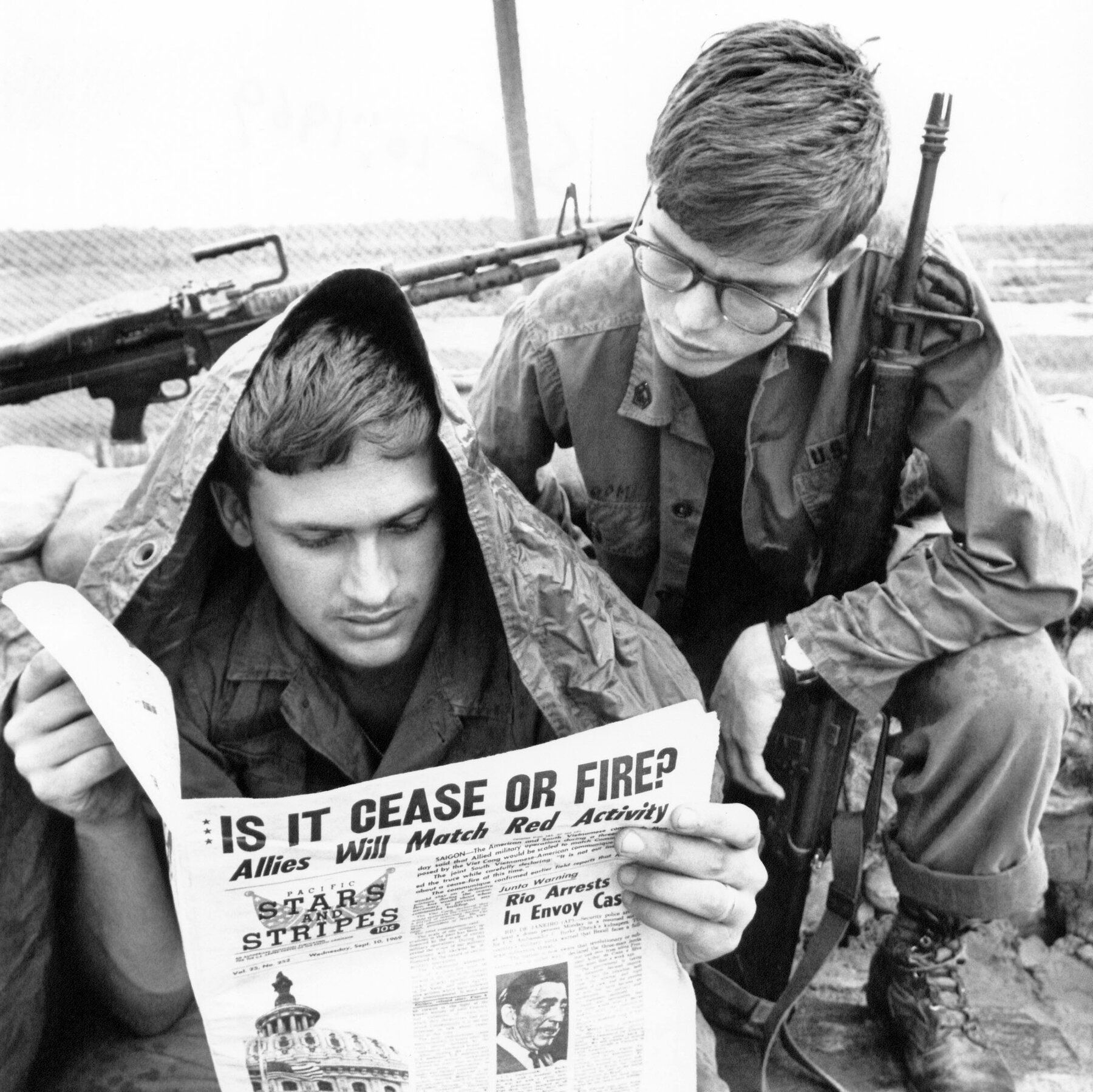 Service members reading Stars and Stripes in Cu Chi, South Vietnam, in September 1969. - nytimes.com