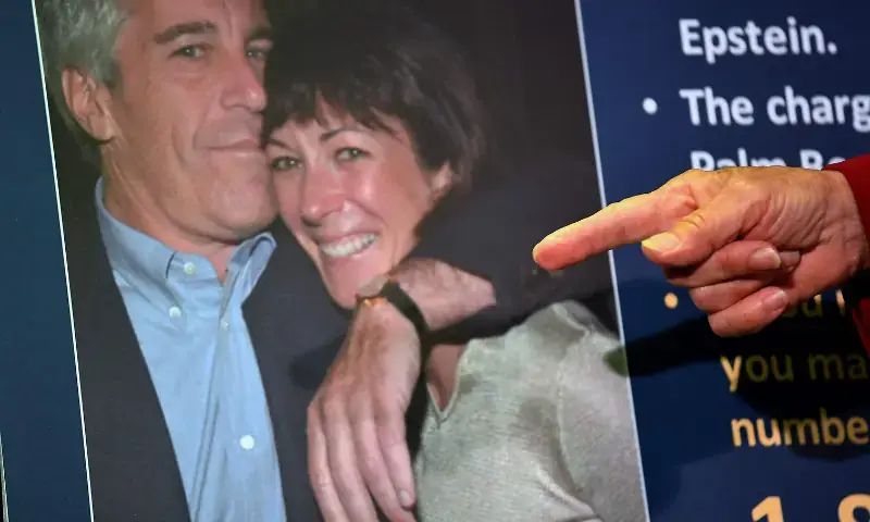 Acting U.S. Attorney for the Southern District of New York Audrey Strauss points to a photo of Jeffrey Epstein and Ghislaine Maxwell while announcing charges against Maxwell in New York City on July 2, 2020. - AFP/File