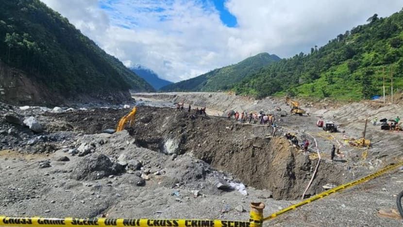 Nepal Army soldiers and rescuers work during a search-and-rescue operation near hydropower project sites in Rasuwa district. - Nepal Army/Handout via Reuters