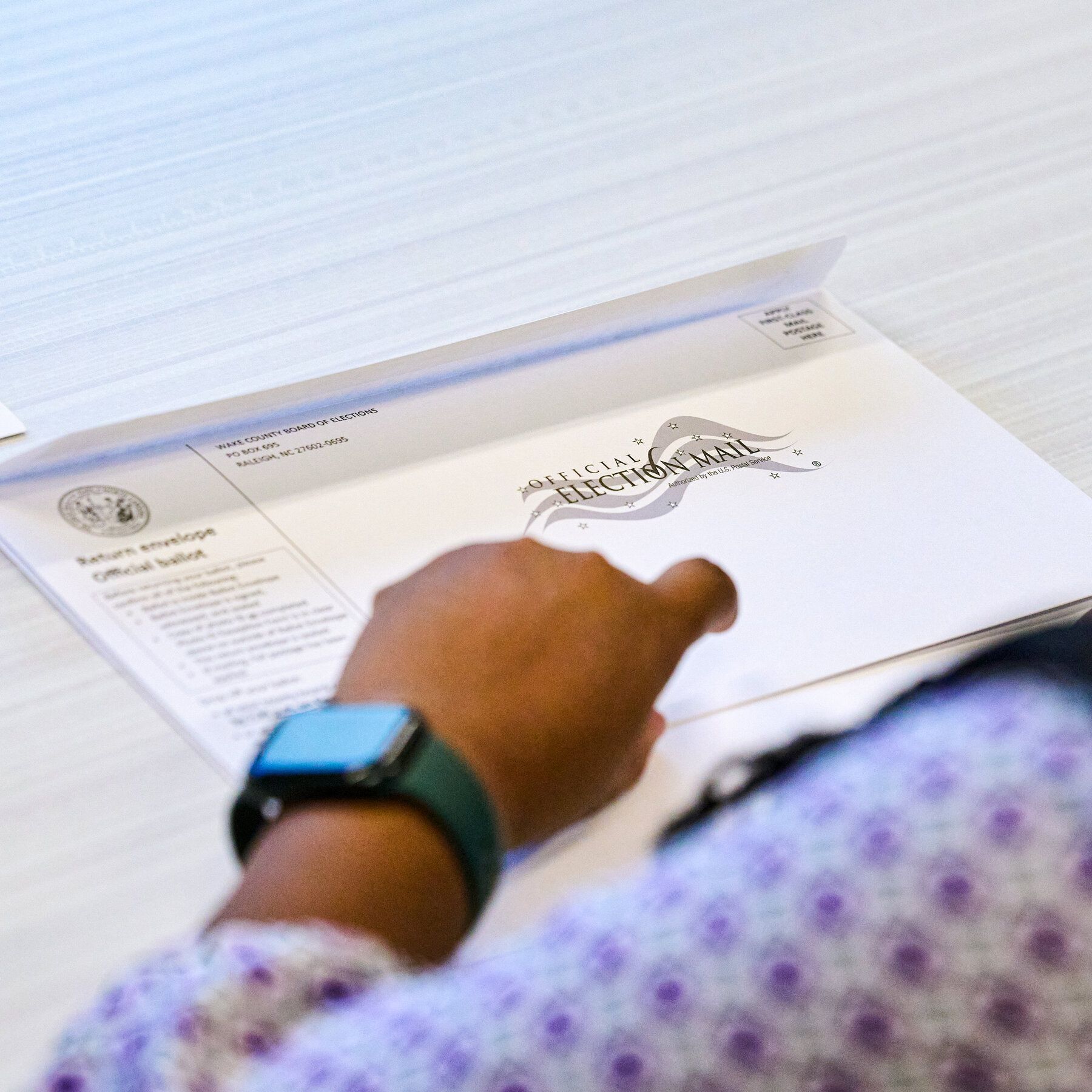 Wake County Board of Elections employees prepare absentee ballots to be mailed in Raleigh, N.C., on Thursday. - nytimes.com