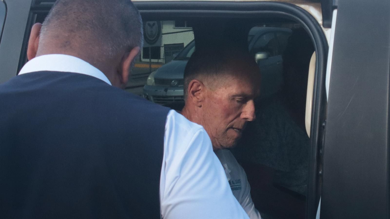 Martin Robinson leaves a courthouse in Ensenada, Mexico, after the trial opened in the killings of two Australians and a U.S. citizen. - AP Photo/Tashiro Malekium