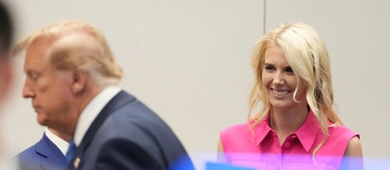 White House aide Natalie Harp, right, looks after President Donald Trump, left, spoke to astronauts aboard the International Space Station, Friday, Aug. 28, 2026, at Johnson Space Center's Mission Control in Houston. - AP Photo/Mark Schiefelbein