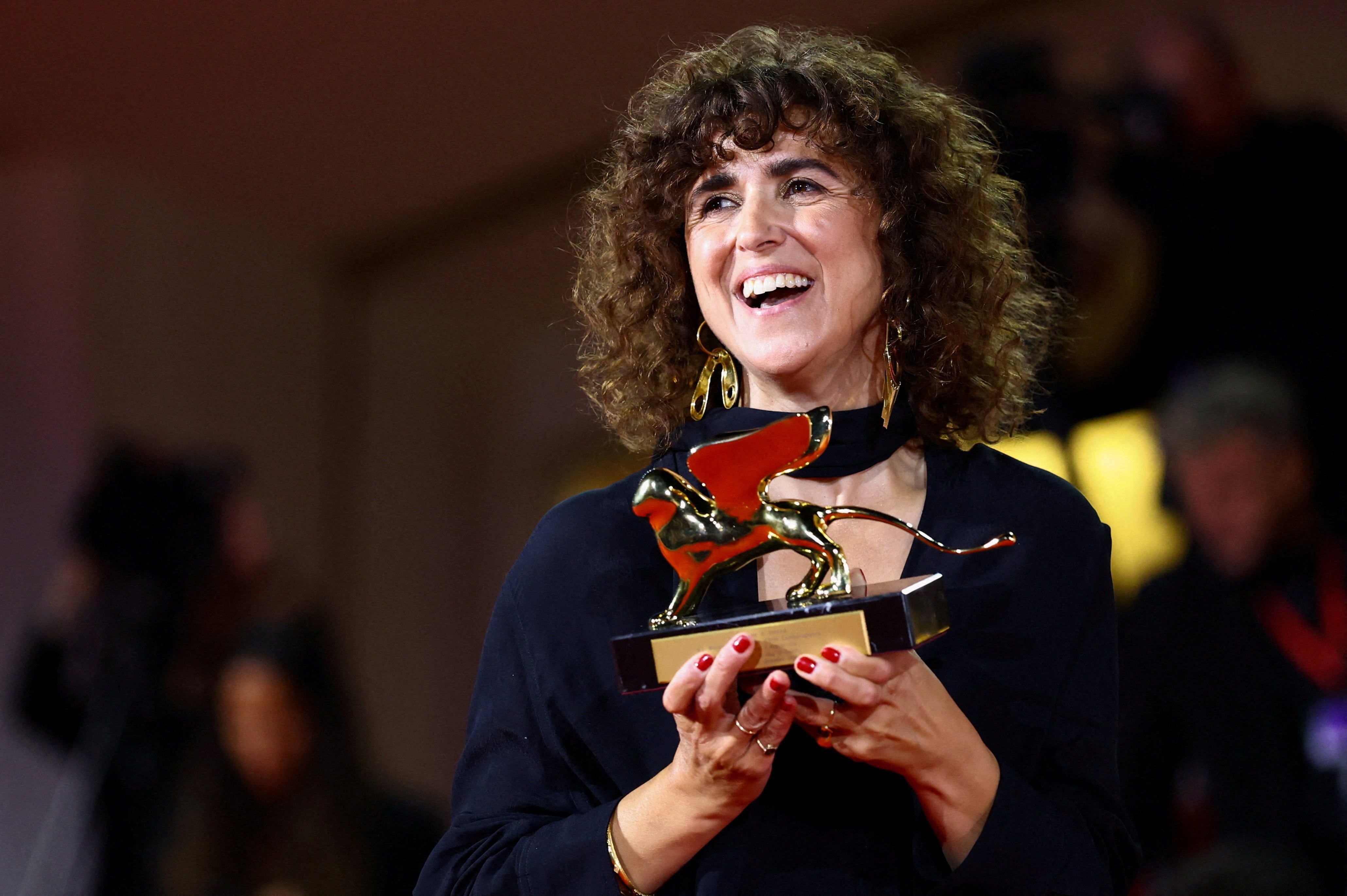 May el-Toukhy with the Golden Lion after “Woman Unknown” won best film at Venice. - Reuters