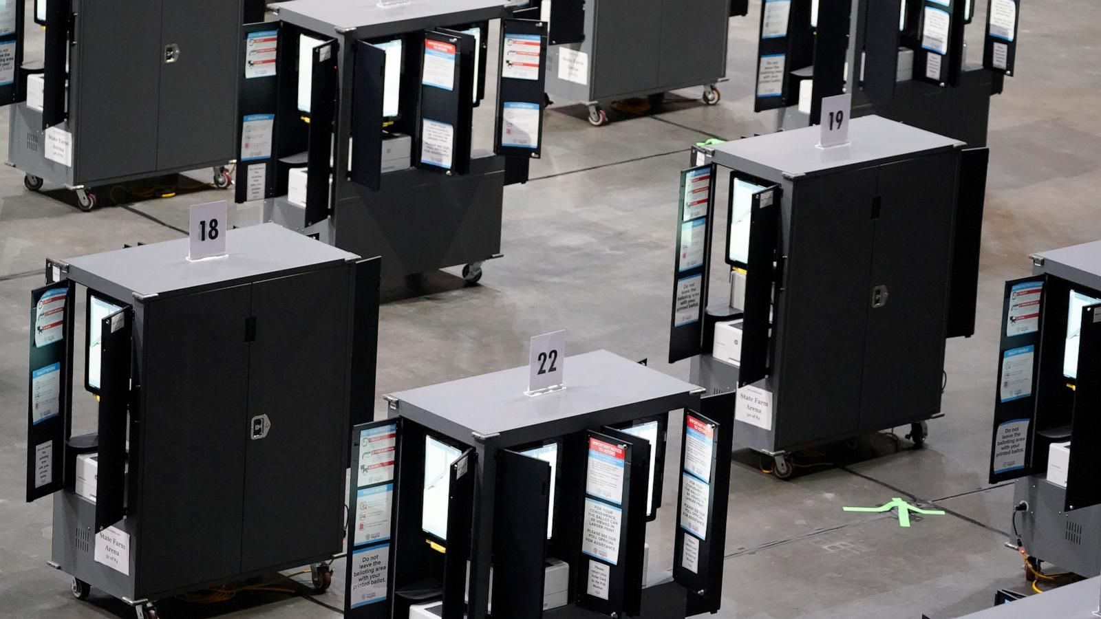Voting machines fill the floor for early voting at State Farm Arena in Atlanta. - Brynn Anderson/AP