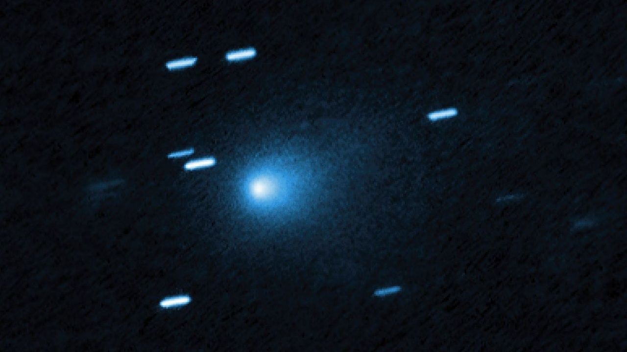 Hubble image of interstellar comet 3I/ATLAS on July 21, 2025, showing a teardrop-shaped dust cocoon around its icy nucleus. - Hubble