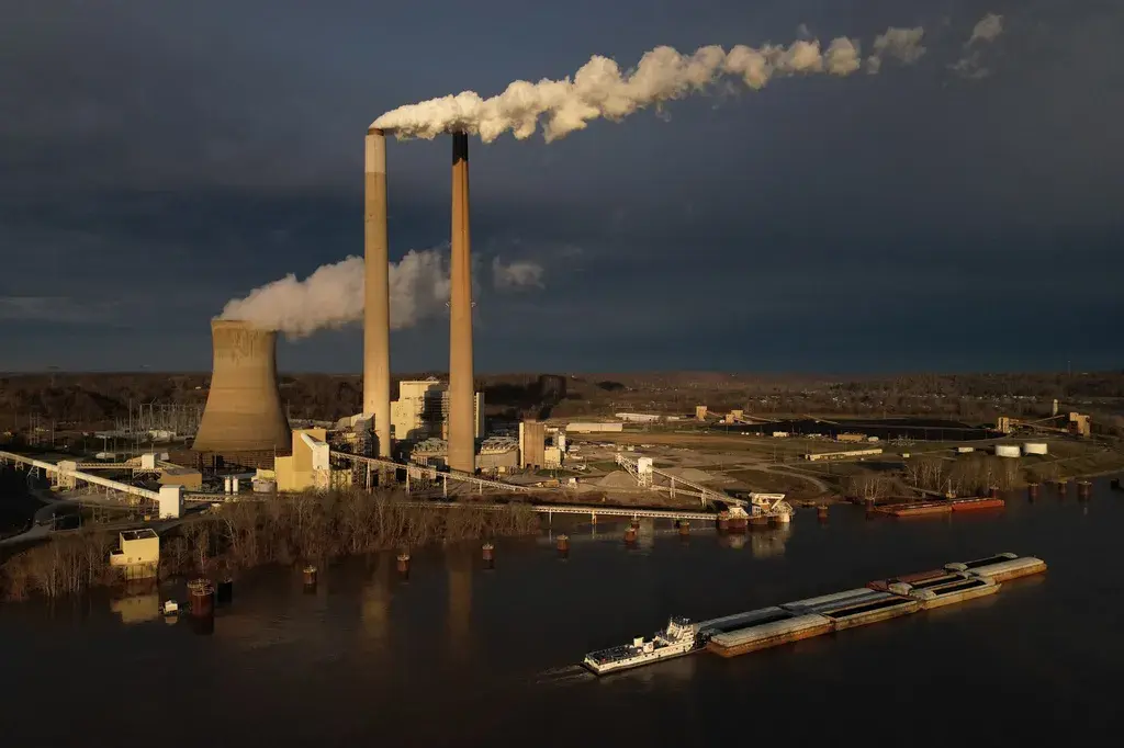 A barge passes the Mountaineer coal-fired power plant near New Haven, West Virginia, on March 13, 2026. - Carolyn Kaster/AP
