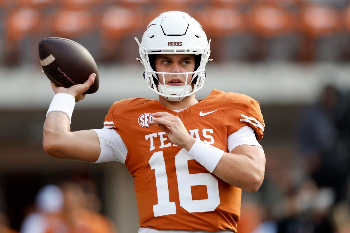 Texas quarterback Arch Manning apologized after criticism of his reaction to an AI-generated clip involving Holly Rowe. - Getty Images