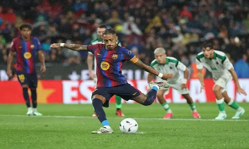 Raphinha shoots from the penalty spot during Barcelona’s 7-2 win over Racing Santander at Camp Nou on September 16, 2026. - AFP