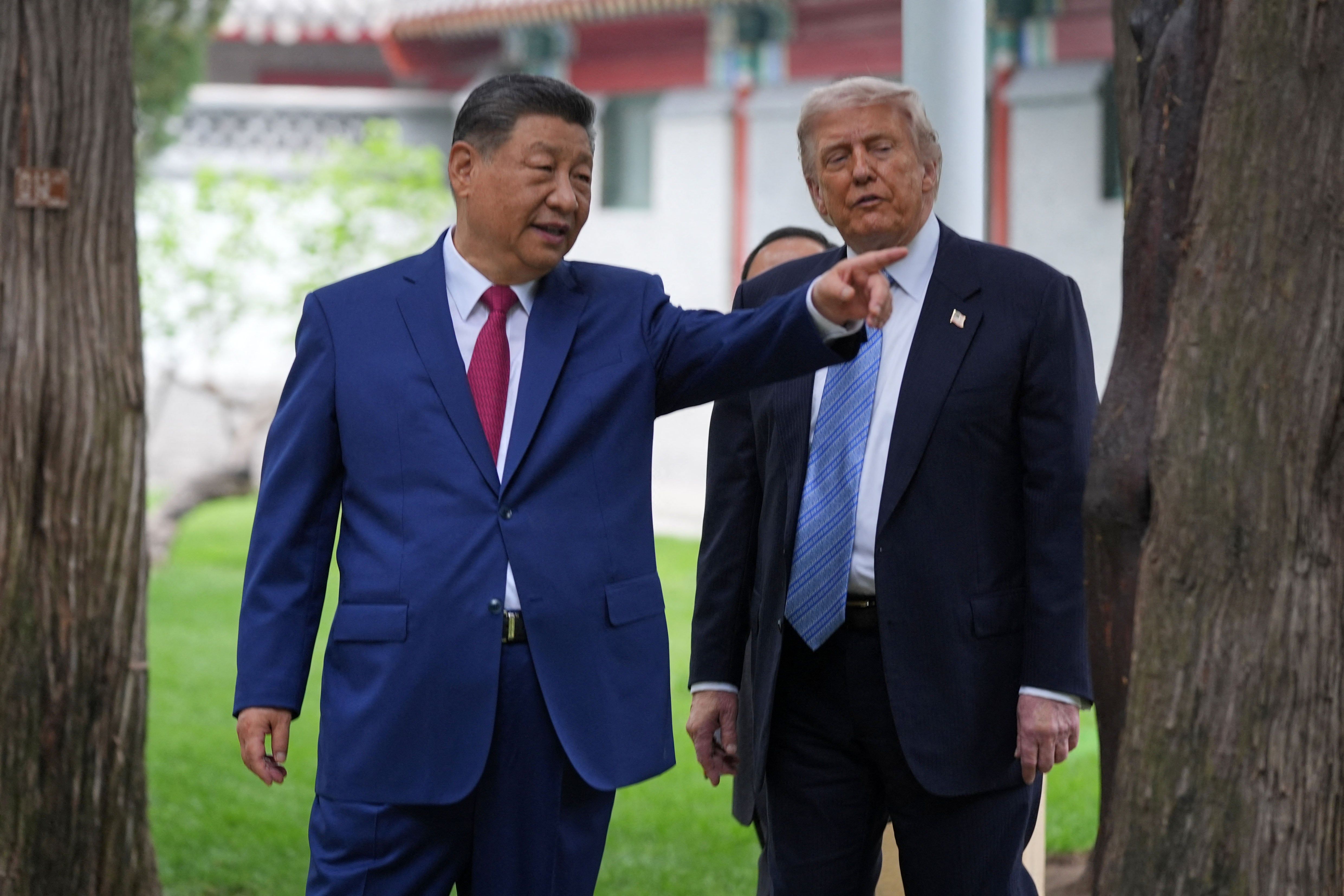 Xi Jinping and Donald Trump at an earlier summit in China. - AFP