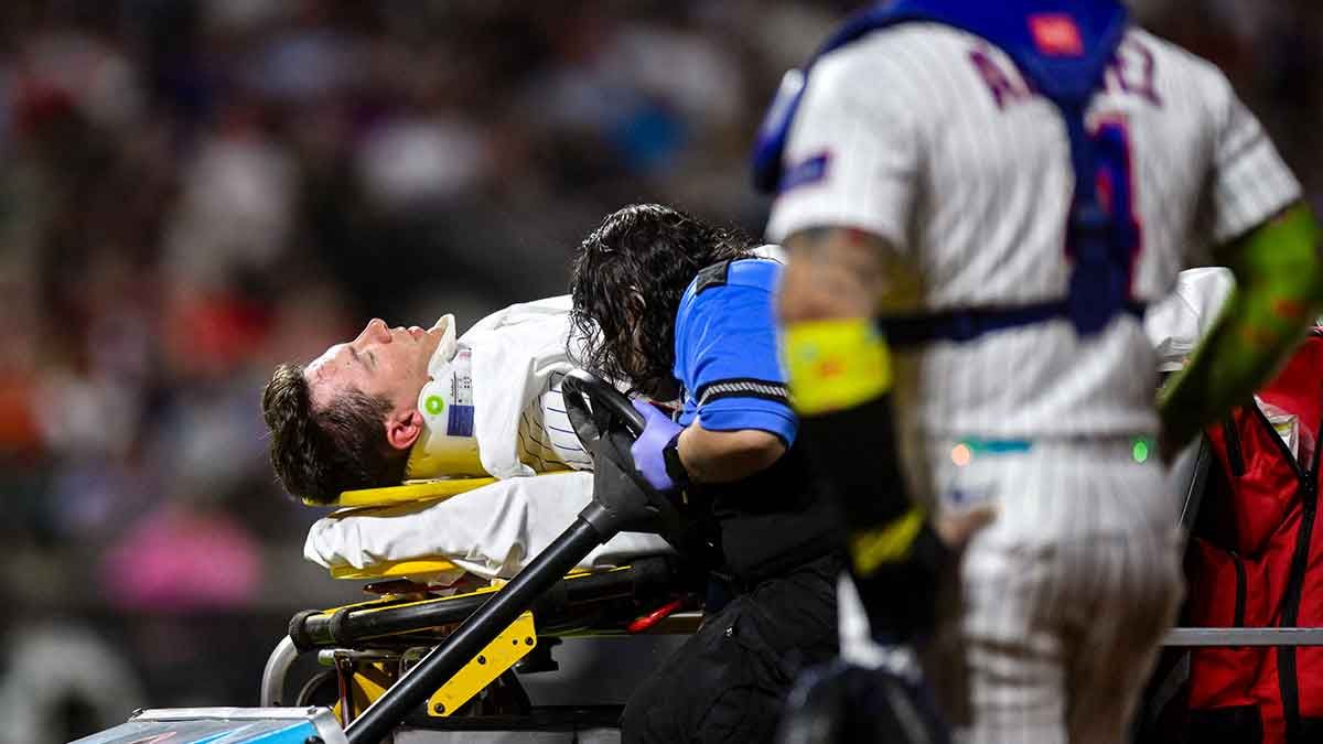 Jared Young receives medical attention at first base after colliding with teammate Nolan McLean at Citi Field on Sept. 17, 2026. - John Jones-Imagn Images