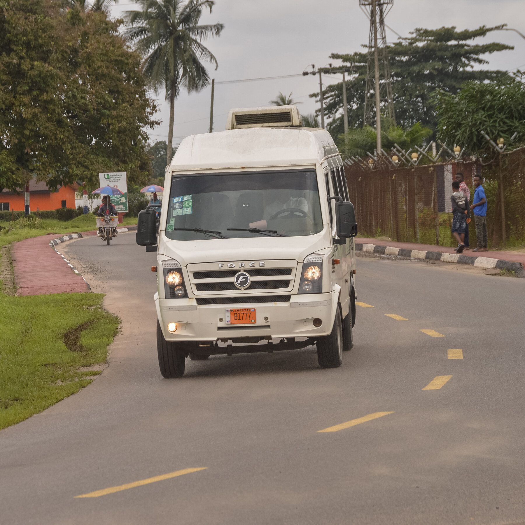 A bus carrying people deported from the United States leaves the international airport outside Monrovia, Liberia. - nytimes.com