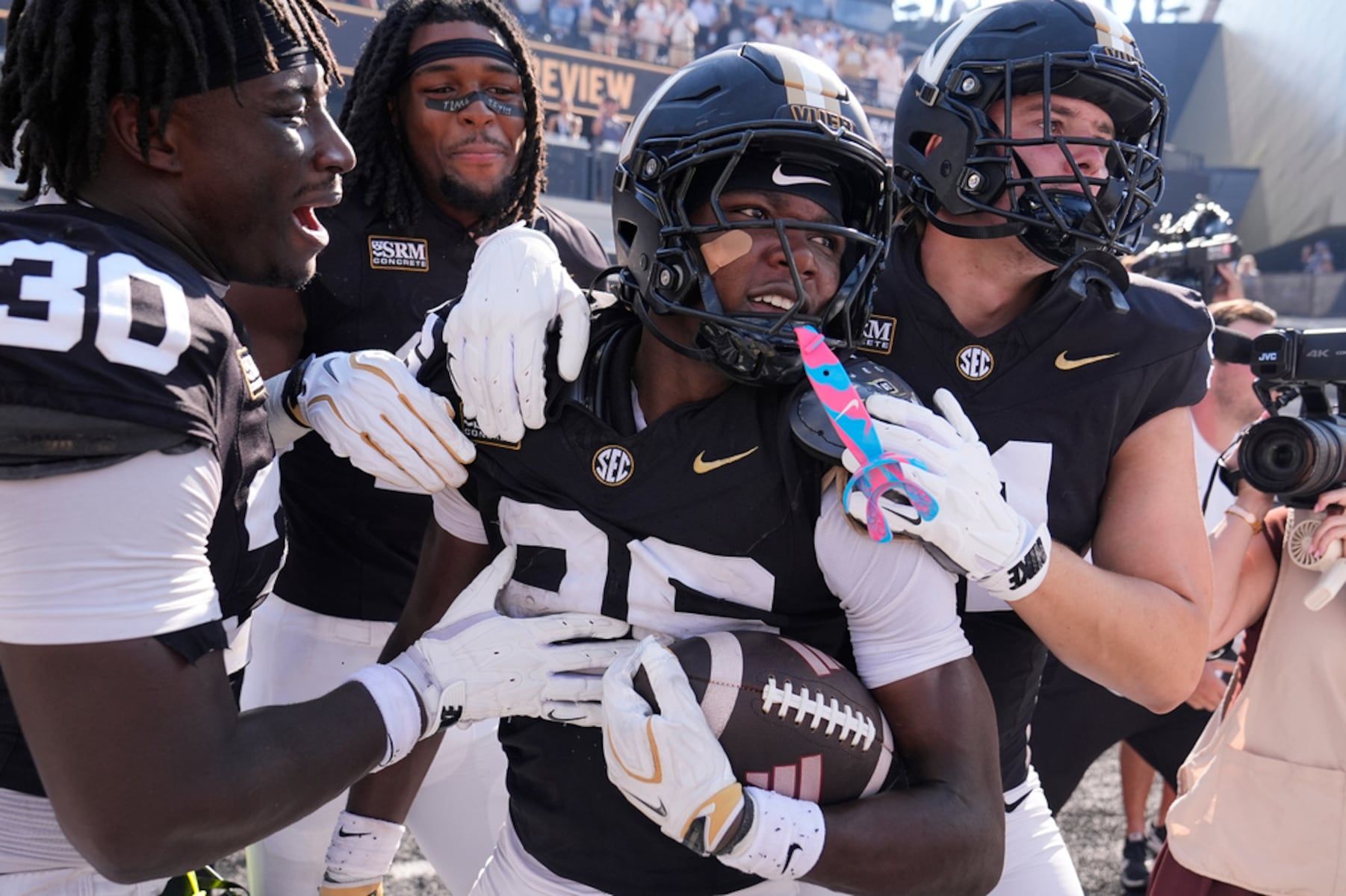 Vanderbilt cornerback Cayden Daniels celebrates his touchdown with teammates against North Carolina State in Nashville, Sept. 19, 2026. - AP Photo/George Walker IV
