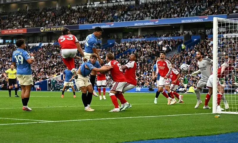 Brighton’s Chema Andrés heads the third goal against Arsenal at the American Express Community Stadium on September 19, 2026. - AFP