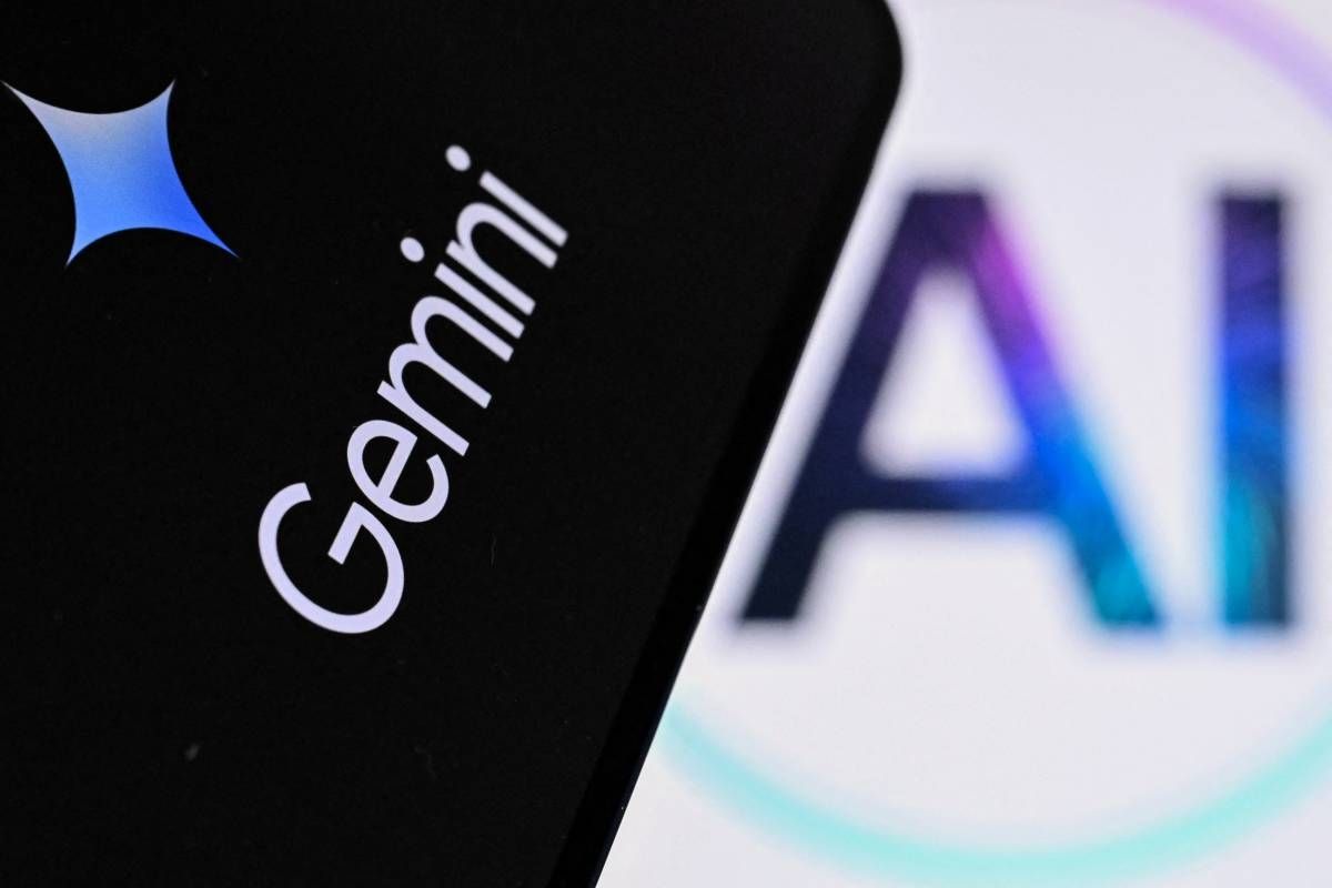 AI lettering beside the Google Gemini application on a smartphone in Frankfurt am Main - AFP