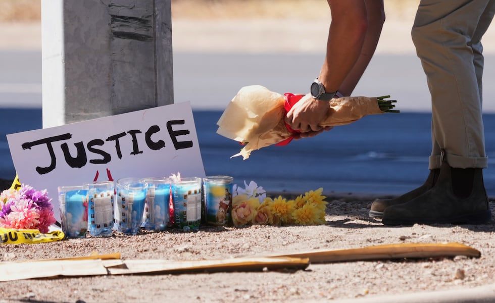 Flowers near the Austin site where a Venezuelan man was shot by an ICE officer. - Eric Gay / Associated Press